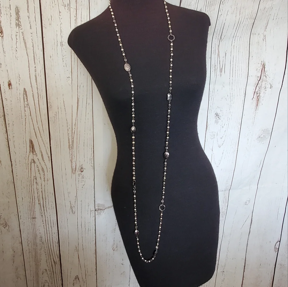 Silvertone and black bead and geometric stations necklace